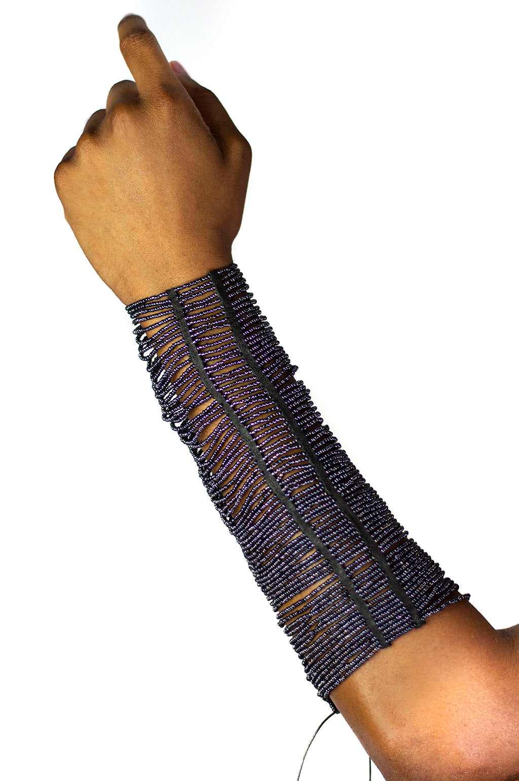 Our Maasai Bead Gauntlets are handcrafted in Kenya by our local artisan using hand-strung glass Maasai beads and genuine leather byproduct sourced from local farms. It is currently available in gunmetal, red or white beading with custom colored beading available. All odAOMO accessories are designed by Dr. Sophia Omoro.