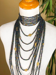 Our Maasai Bead Waterfall Choker is handcrafted in Kenya by our local artisan using hand-strung Maasai Glass Beads and leather byproduct from local farms. Each bead and charm is individually strung creating this beautiful statement piece. All odAOMO jewelry is designed by Dr. Sophia Omoro.